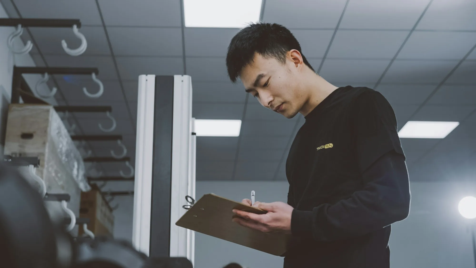 Inspector writing notes on a clipboard